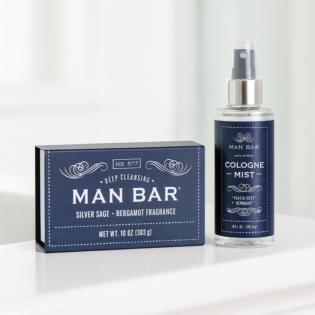 Man Bar Silver Sage and Bergamot soap box beside a cologne mist spray bottle with navy labels

